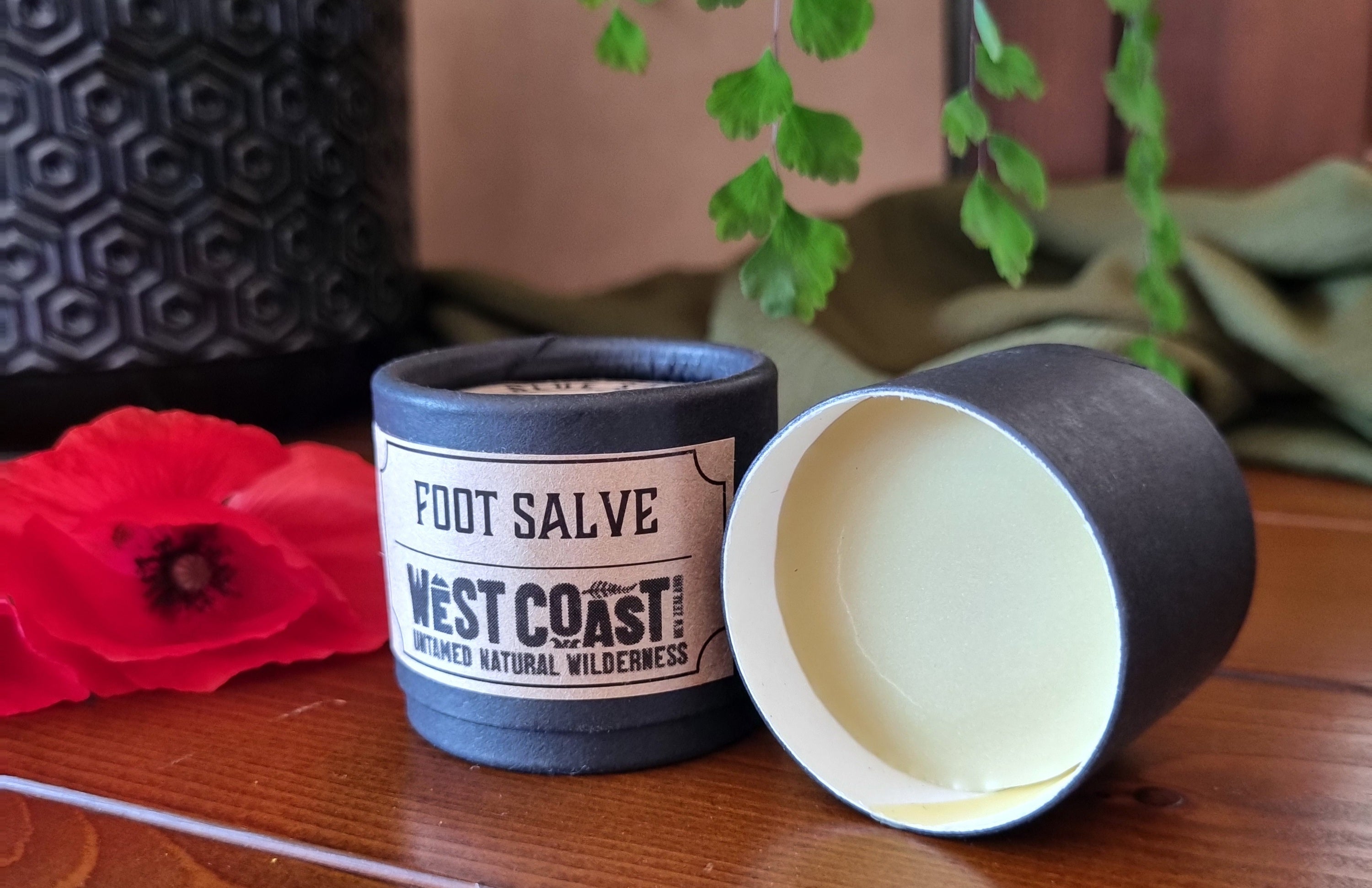 0nr 20gm black paperboard jar of foot salve with red poppy
